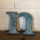 Blue metal letter "N"