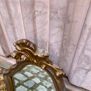 Baroque gold leaf mirror in the Louis XV style from the 19th century.