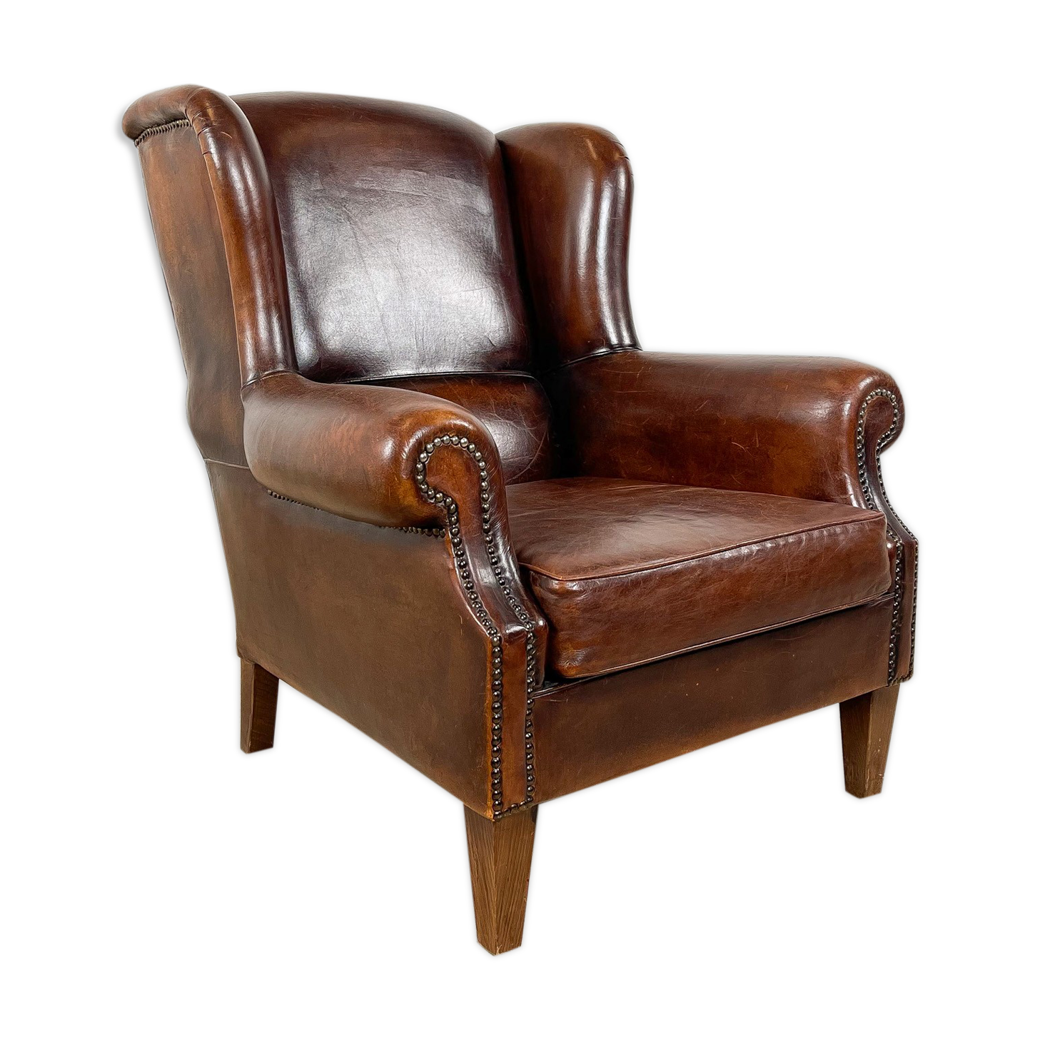 Vintage dark brown sheep leather wingback armchair