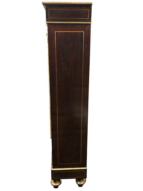 Varnished wood showcase and gold decoration in imitation of the so-called Boulle marquetry
