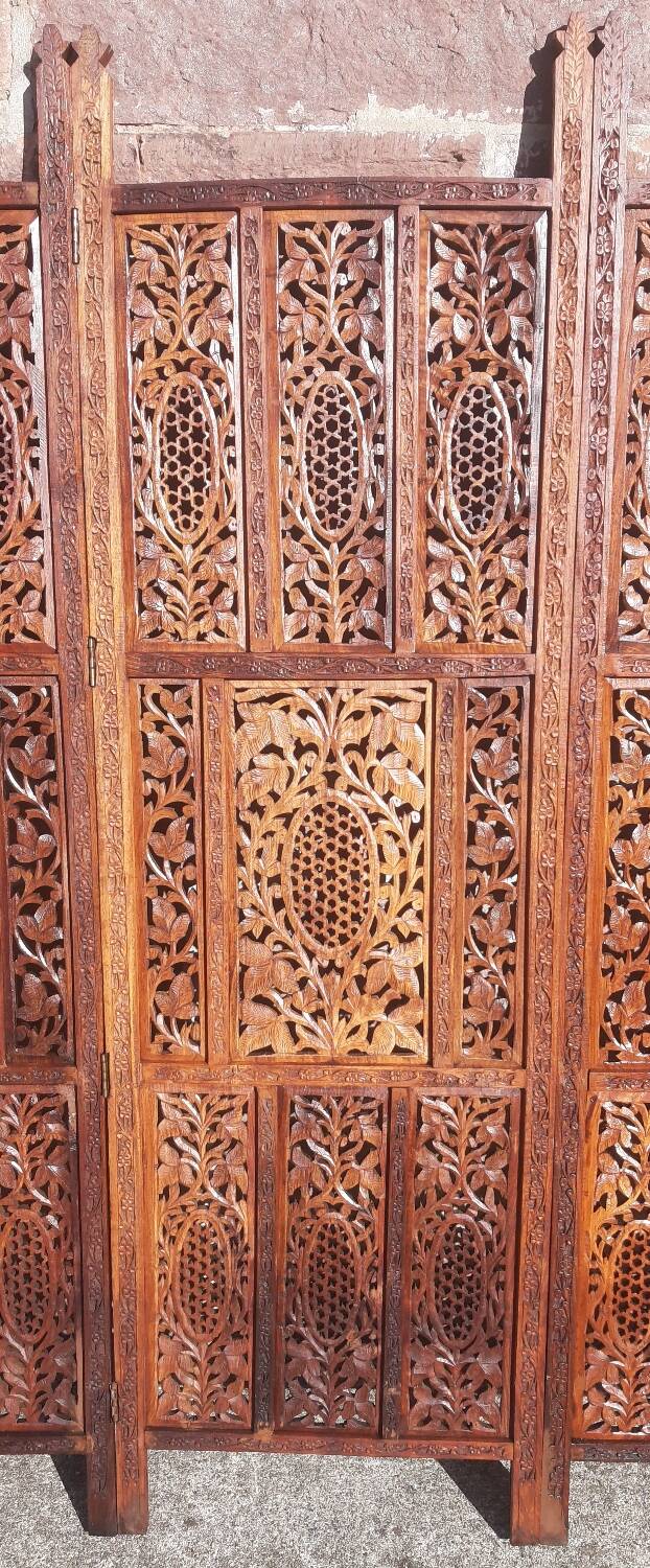 Carved solid wood screen.