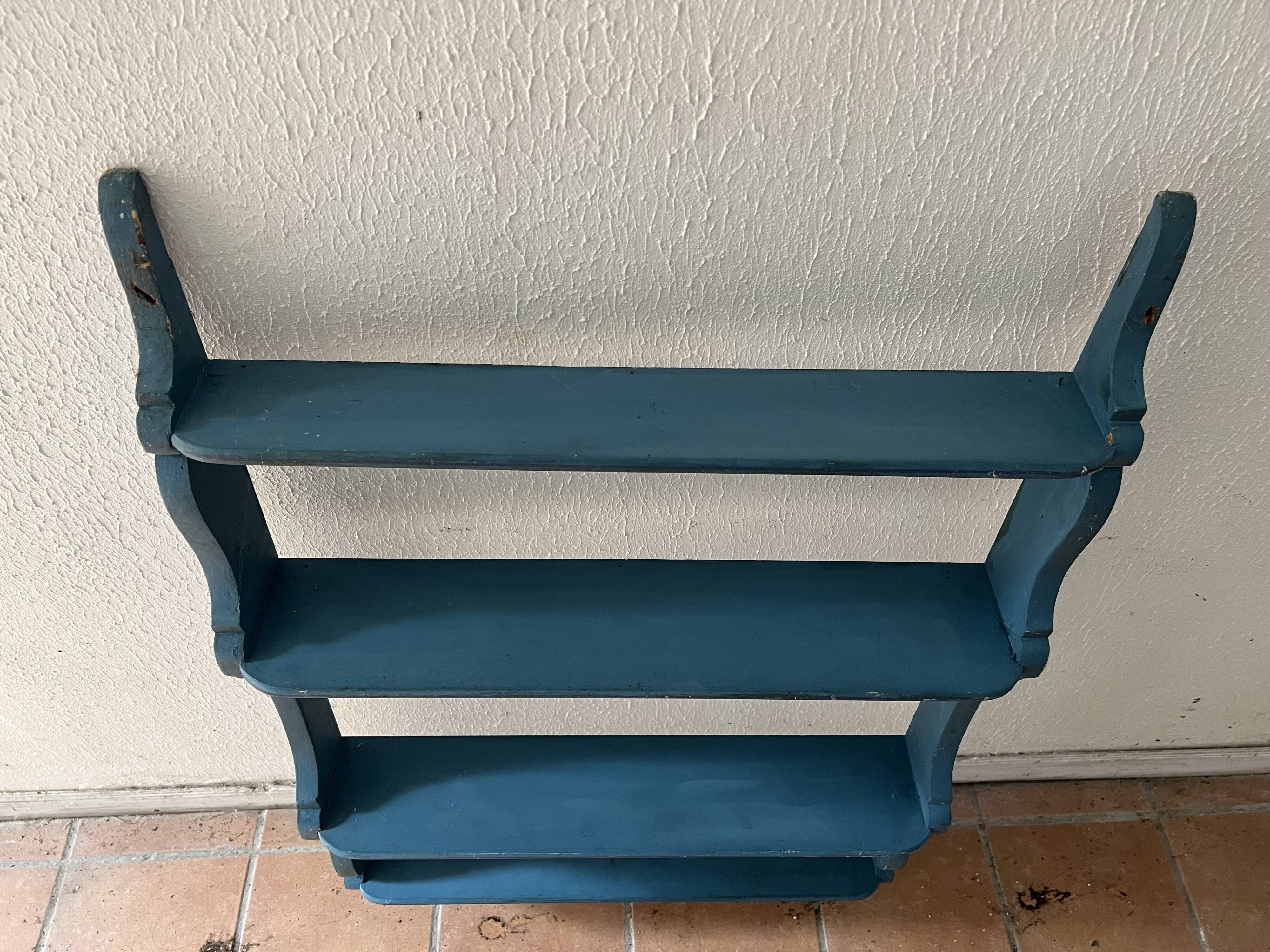 Blue wooden wall shelf