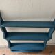 Blue wooden wall shelf