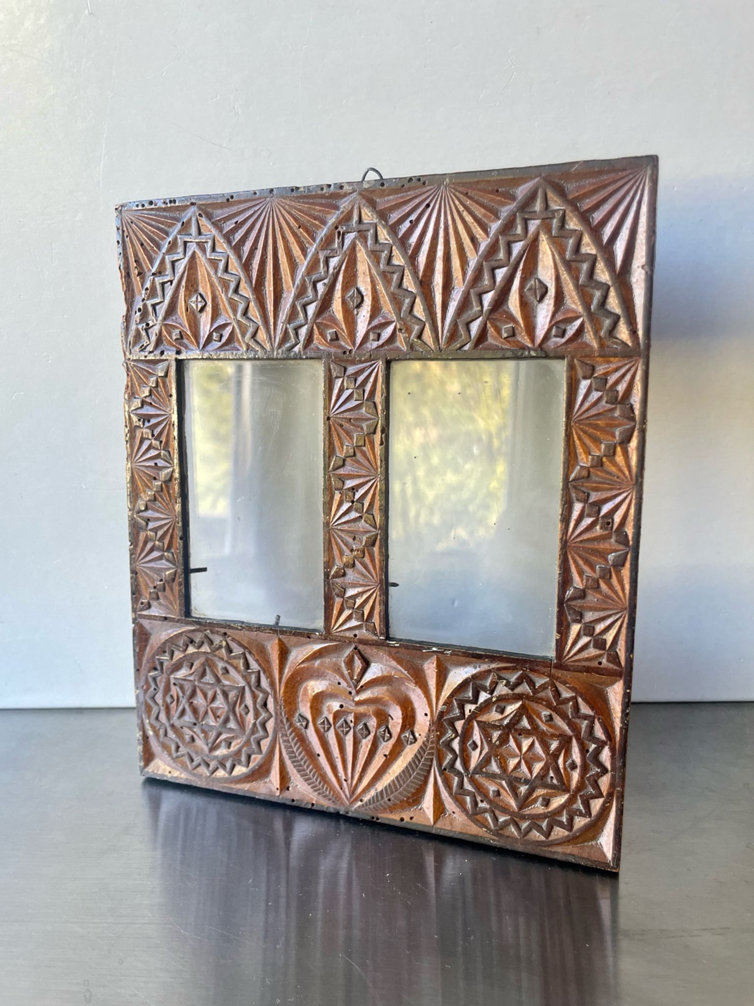 Double frame intricately carved wood