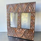 Double frame intricately carved wood