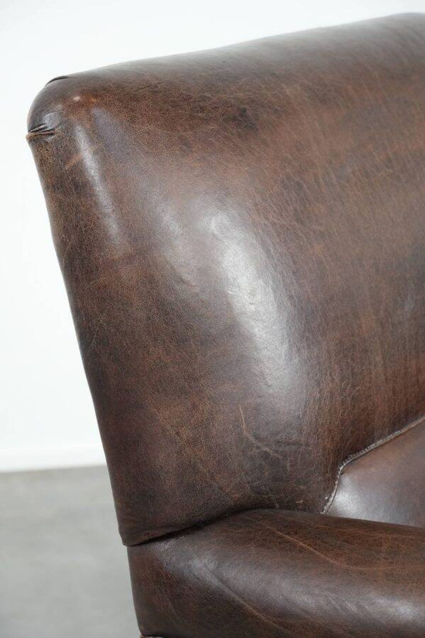 Characterful sheep leather armchair with a beautiful deep colour