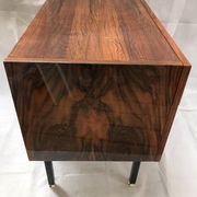 Lacquered 3-drawer chest with rosewood veneer.