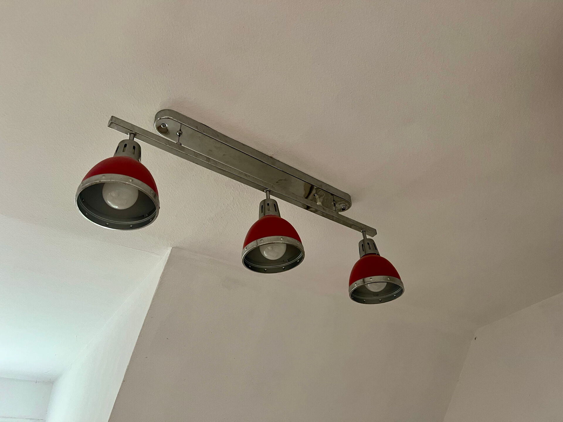 Designer pendant light with 3 red and chrome spots