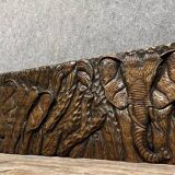 Central Africa 20th century: carved wooden panel in bas-relief of elephants