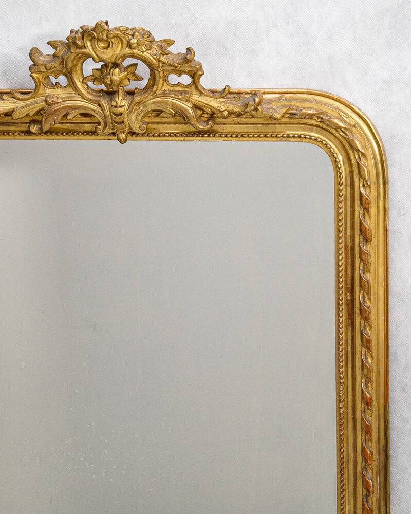 Louis-Philippe mirror from the 19th century with a ribbon trompe-l'œil frame.