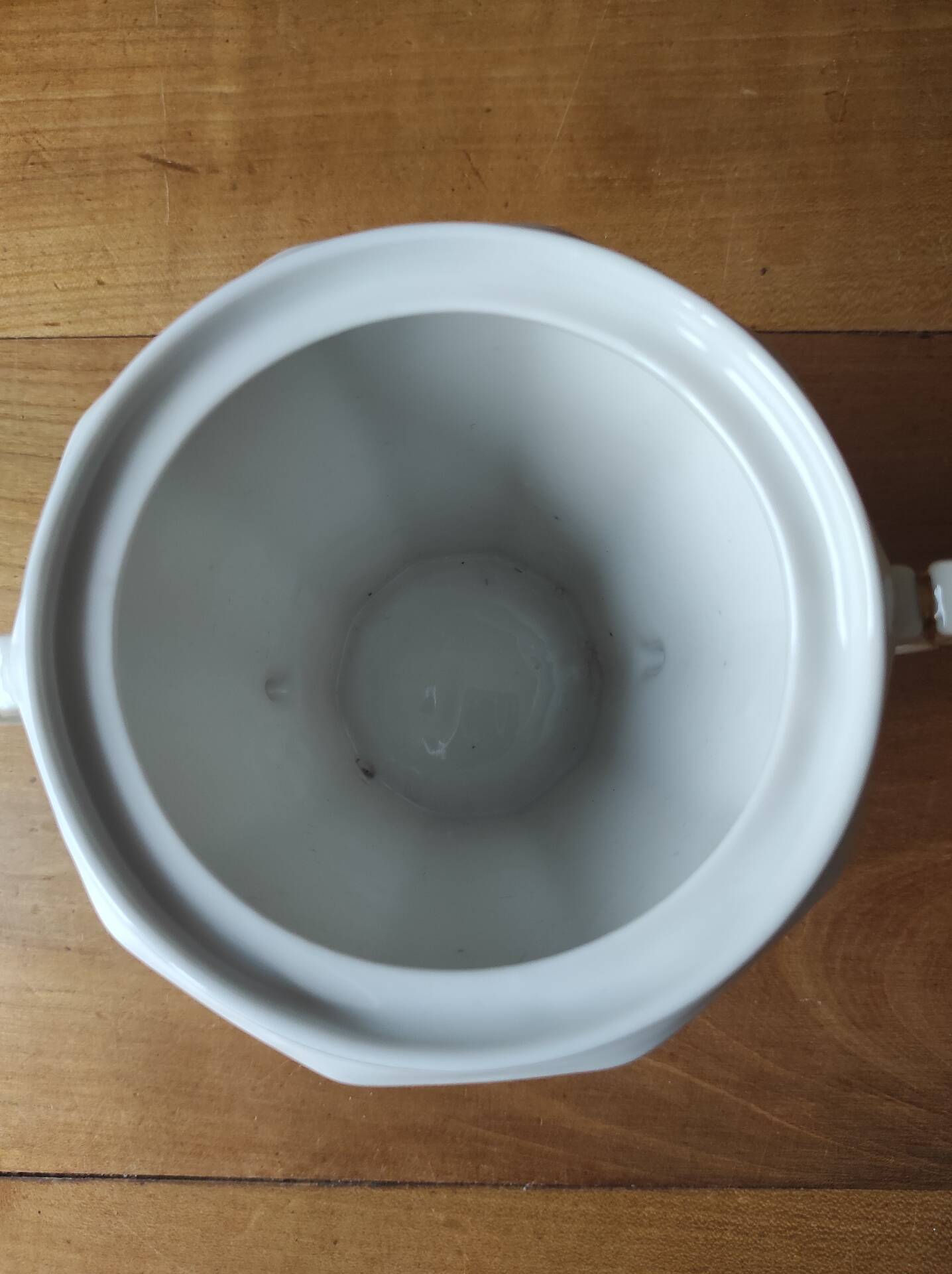 Antique porcelain sugar bowl with a decagonal base.