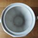 Antique porcelain sugar bowl with a decagonal base.