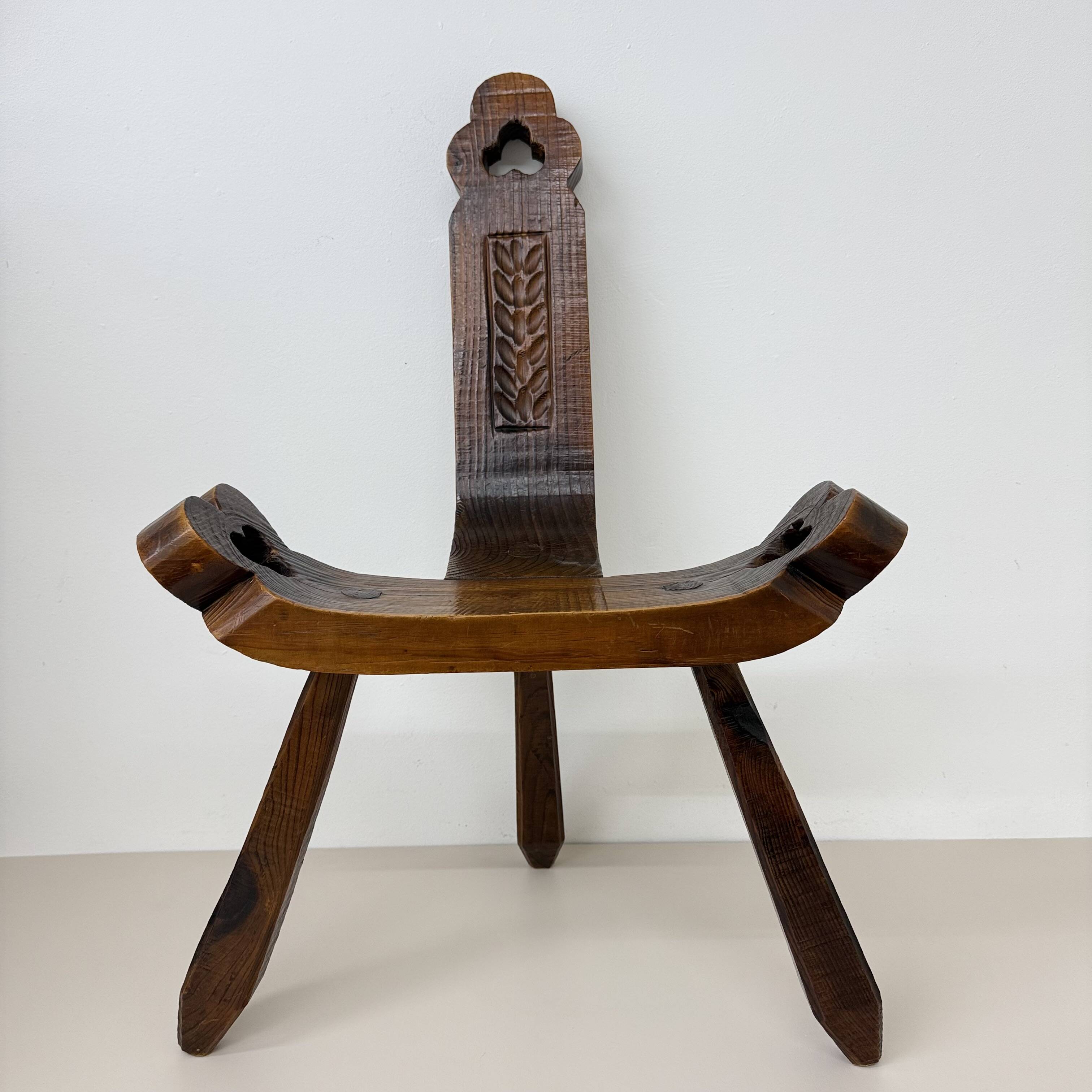Brutalist hand carved oak Spanish tripod chair , 1970s