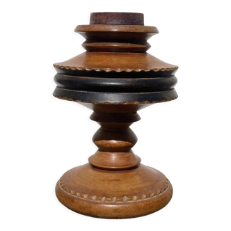 Foot of turned wooden lamp and carved