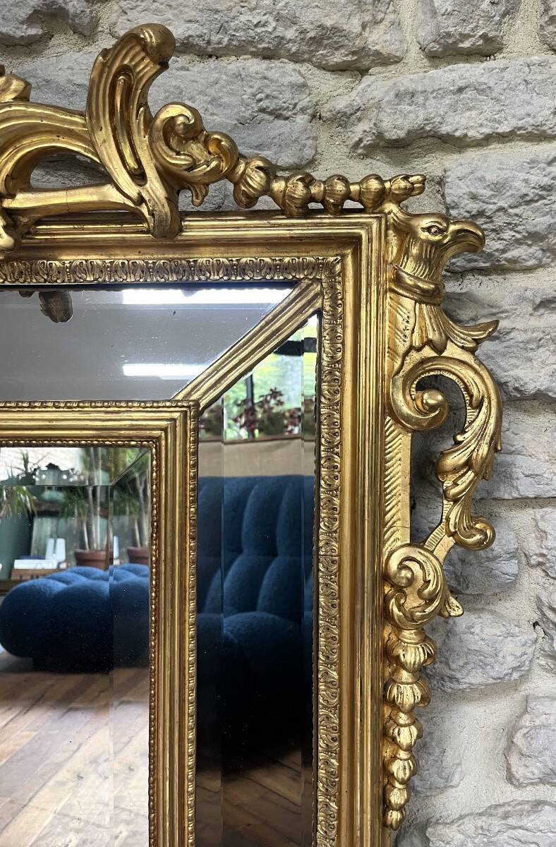Antique mirror with a frame 123/100cm with gilded pediments, eagle heads, antique.