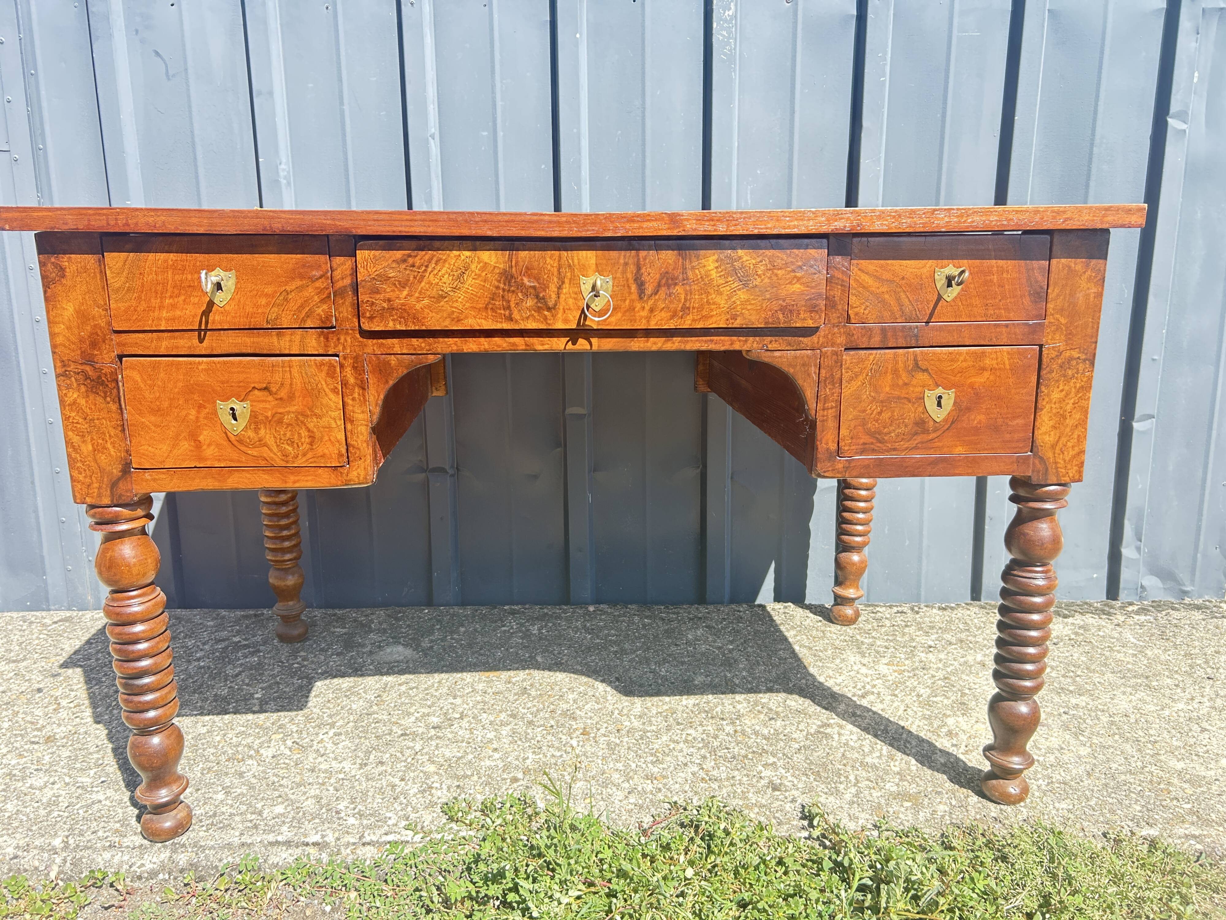 Louis Philippe desk in walnut, with a leather top.