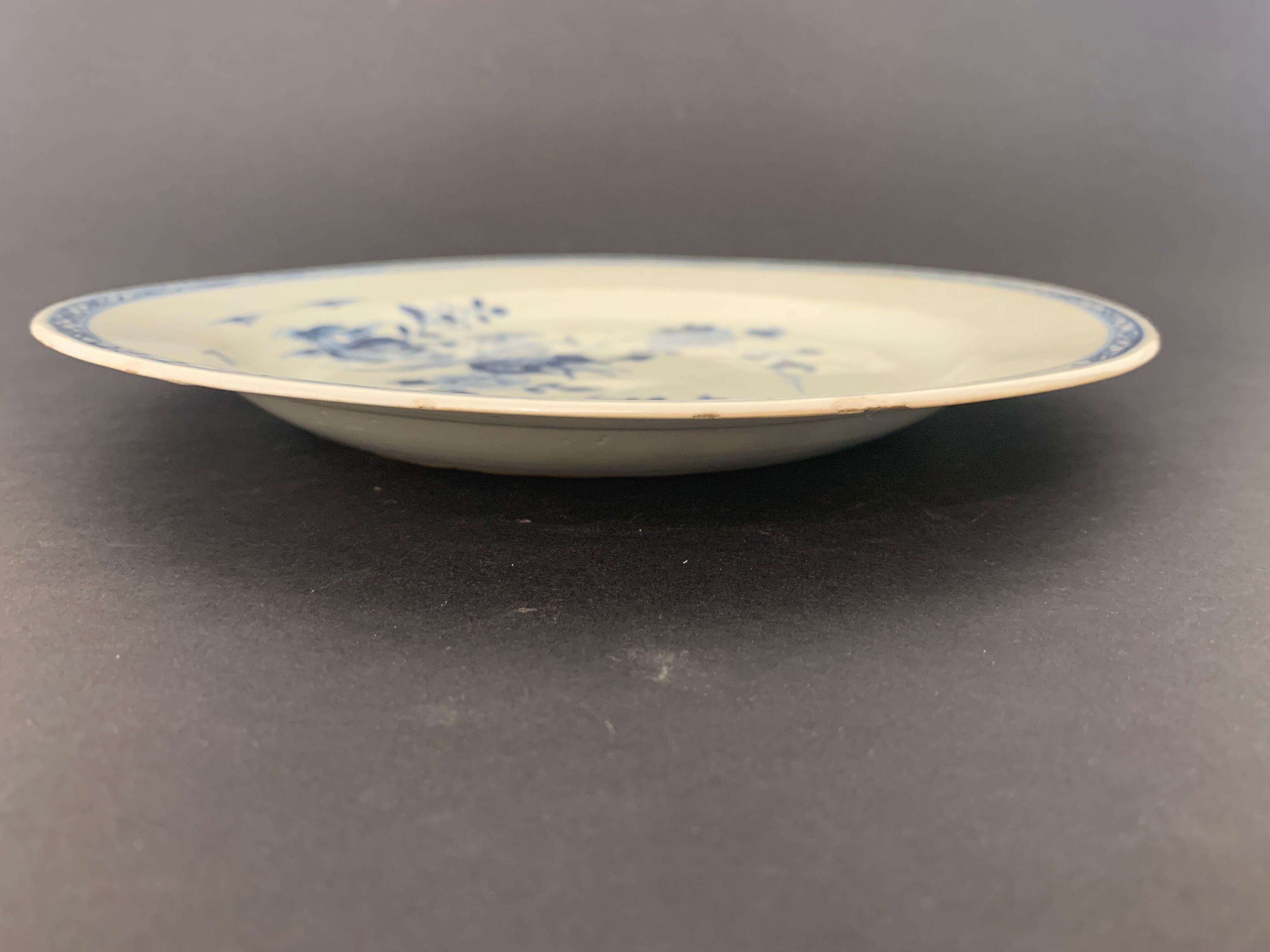 Blue and white porcelain plate of the blue family, 19th century
