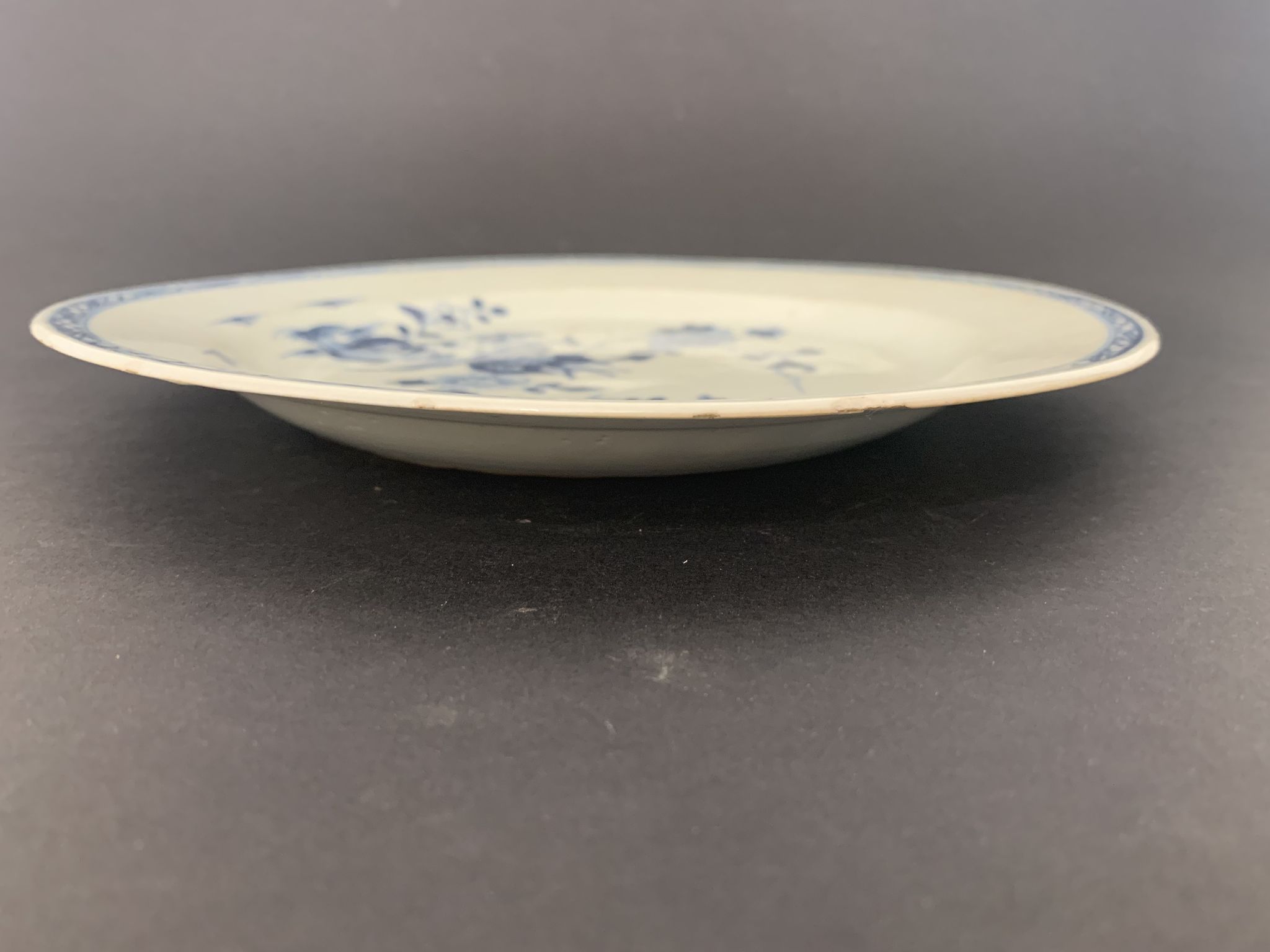 Blue and white porcelain plate of the blue family, 19th century