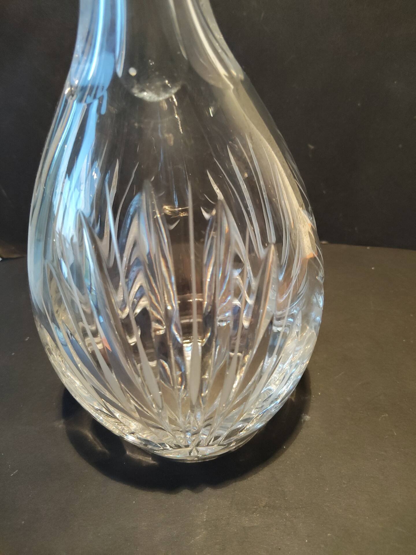 Vintage cut crystal carafe with floral stopper.