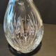 Vintage cut crystal carafe with floral stopper.