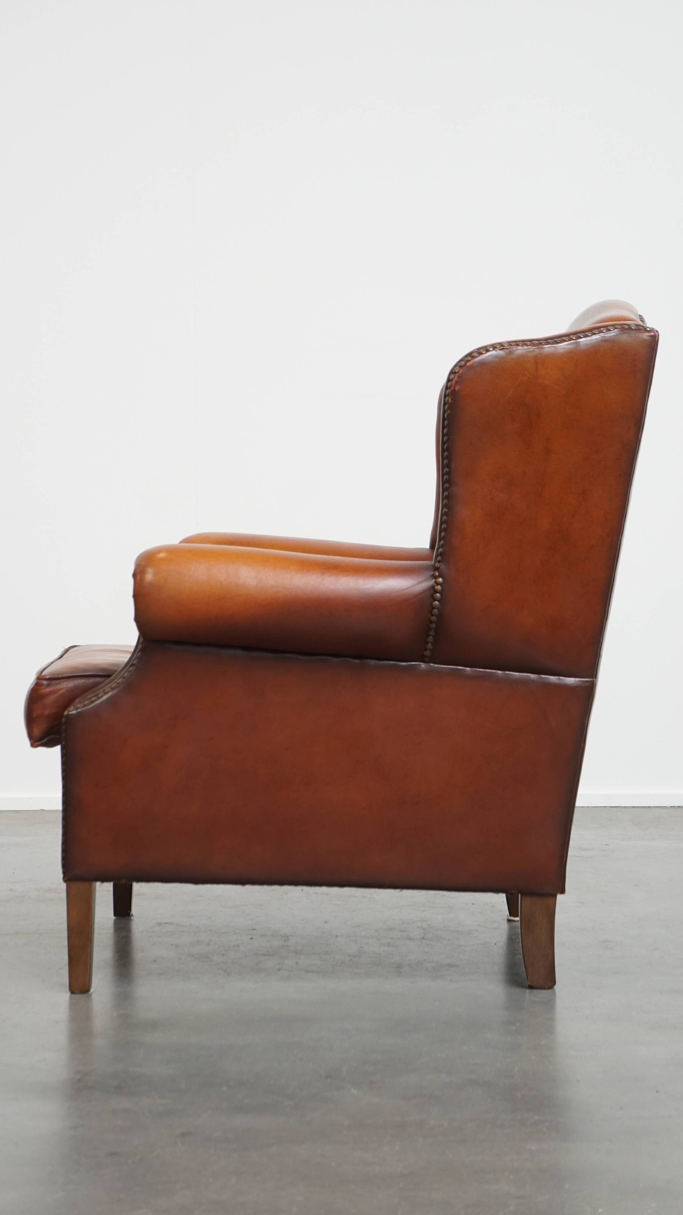Fauteuil à oreilles en cuir de mouton