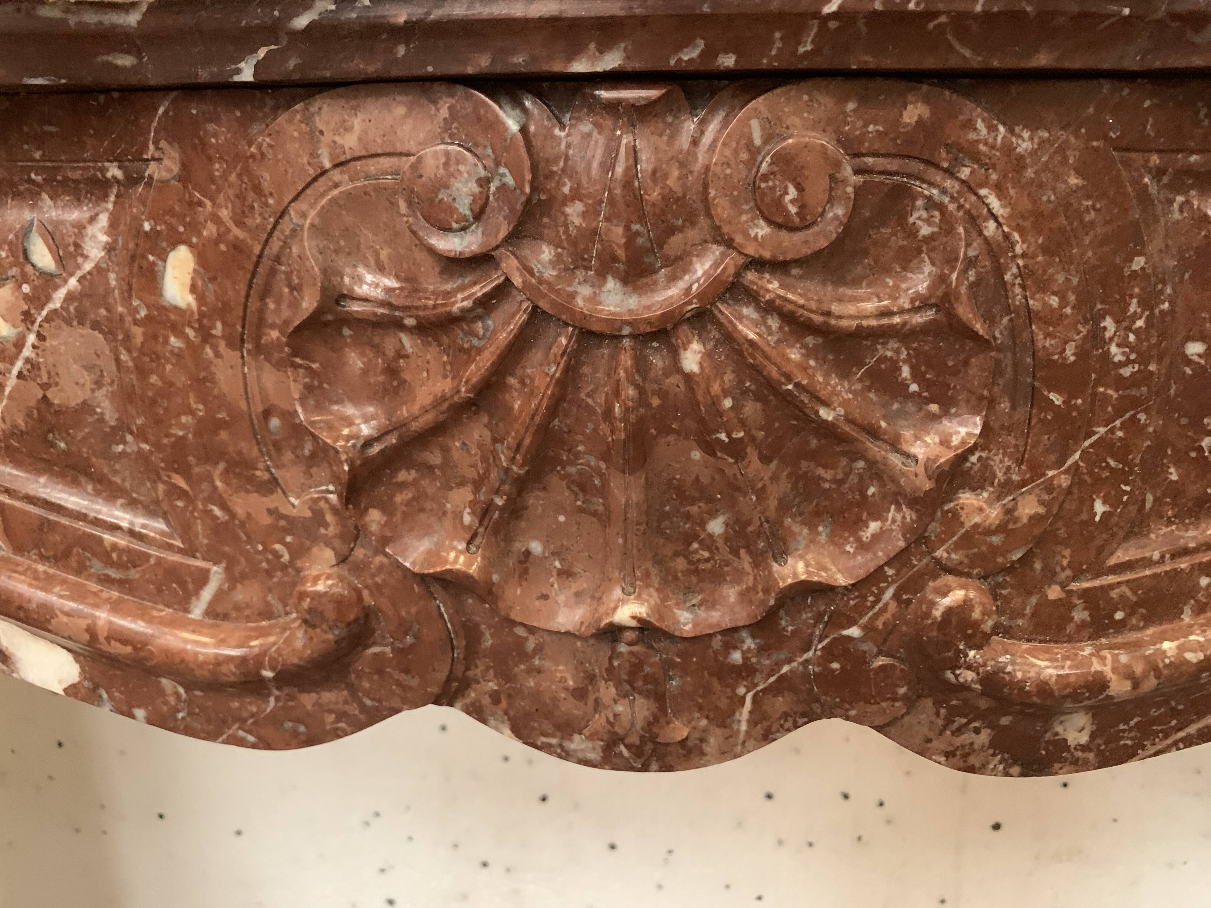 Fireplace three shells louis XV style in royal red marble XIX century