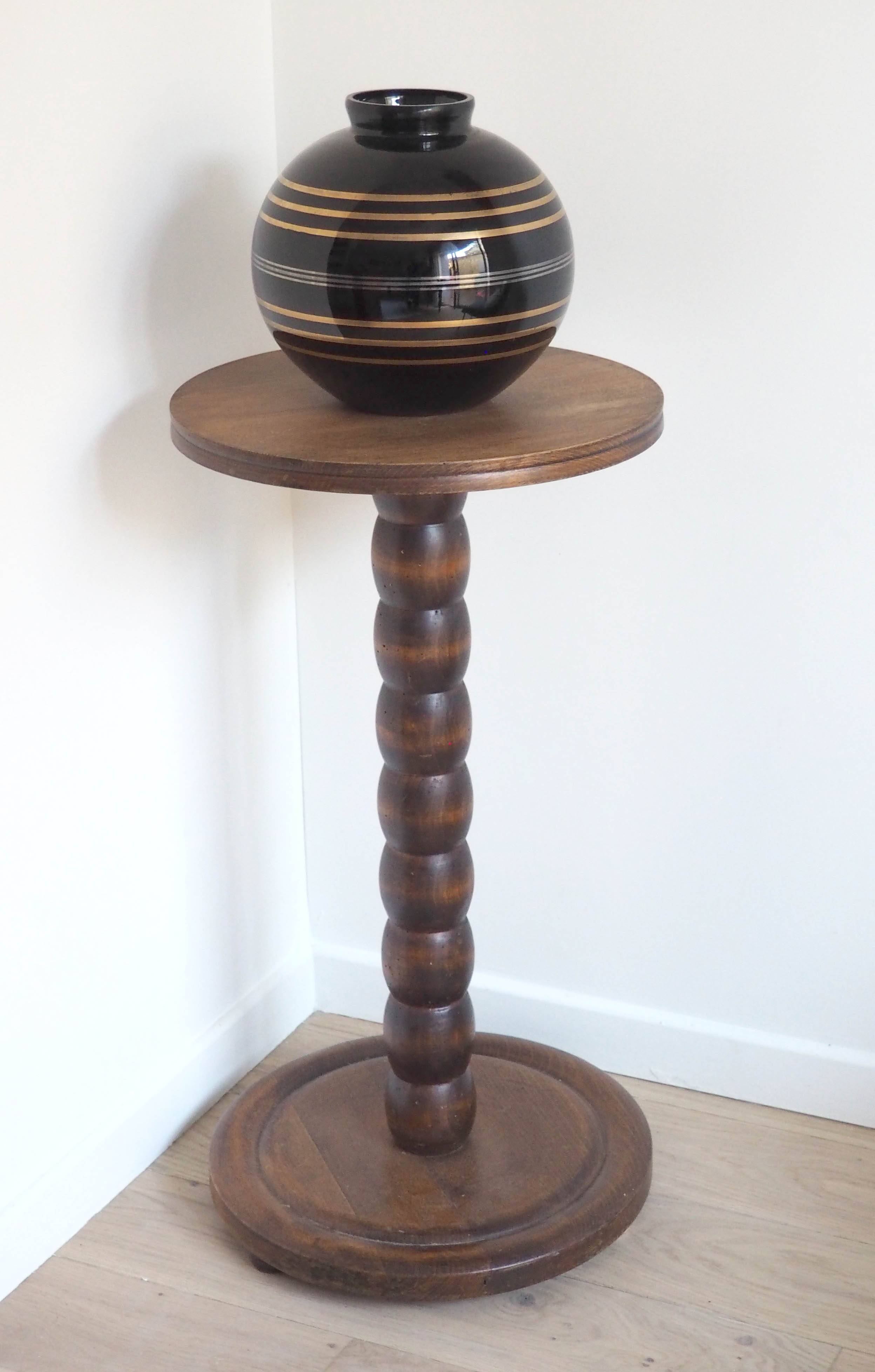 Stele, wooden beaded pedestal table