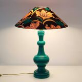 Old lamp with green turned wooden base and printed conical lampshade