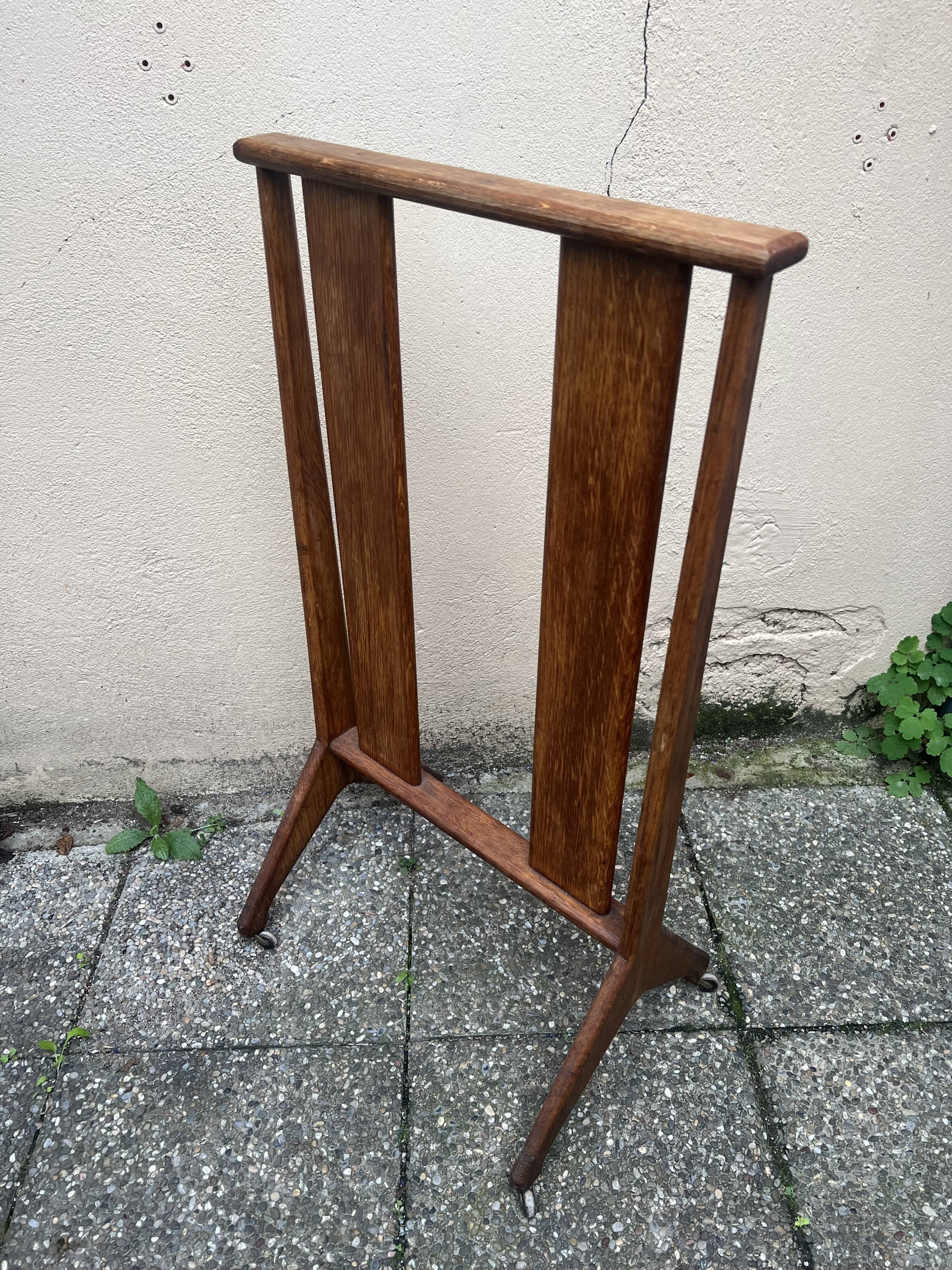 Old wooden shop rack valet casters