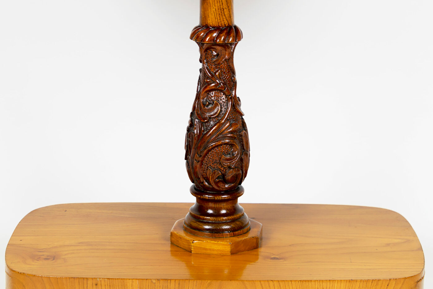 Danish Biedermeier elm occasional table with carved base and drawer