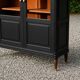 Renovated black antique Louis XVI style display cabinet, glass-fronted bookcase.