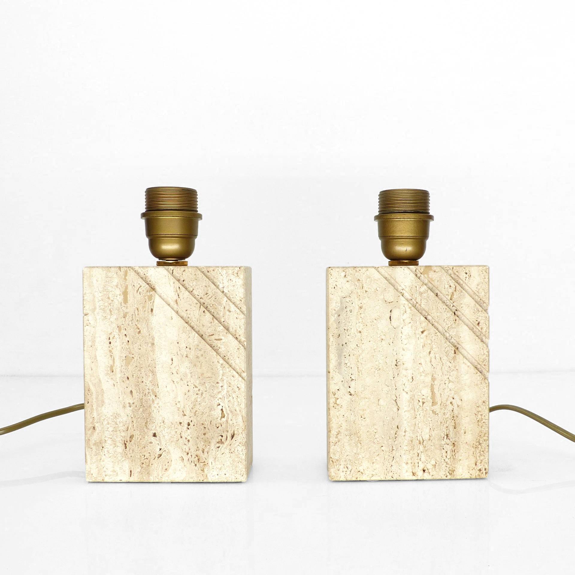 Pair of solid travertine table lamps with incised decoration, French production.