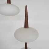 Set of three milk glass and teak pendant lights model NG74 by Louis Kalff for Philips, The Netherlan