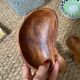 Trio of exotic wooden cups in the shape of beans and vintage clovers