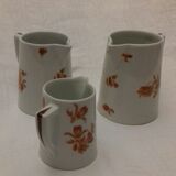 1 set of 3 porcelain pitchers