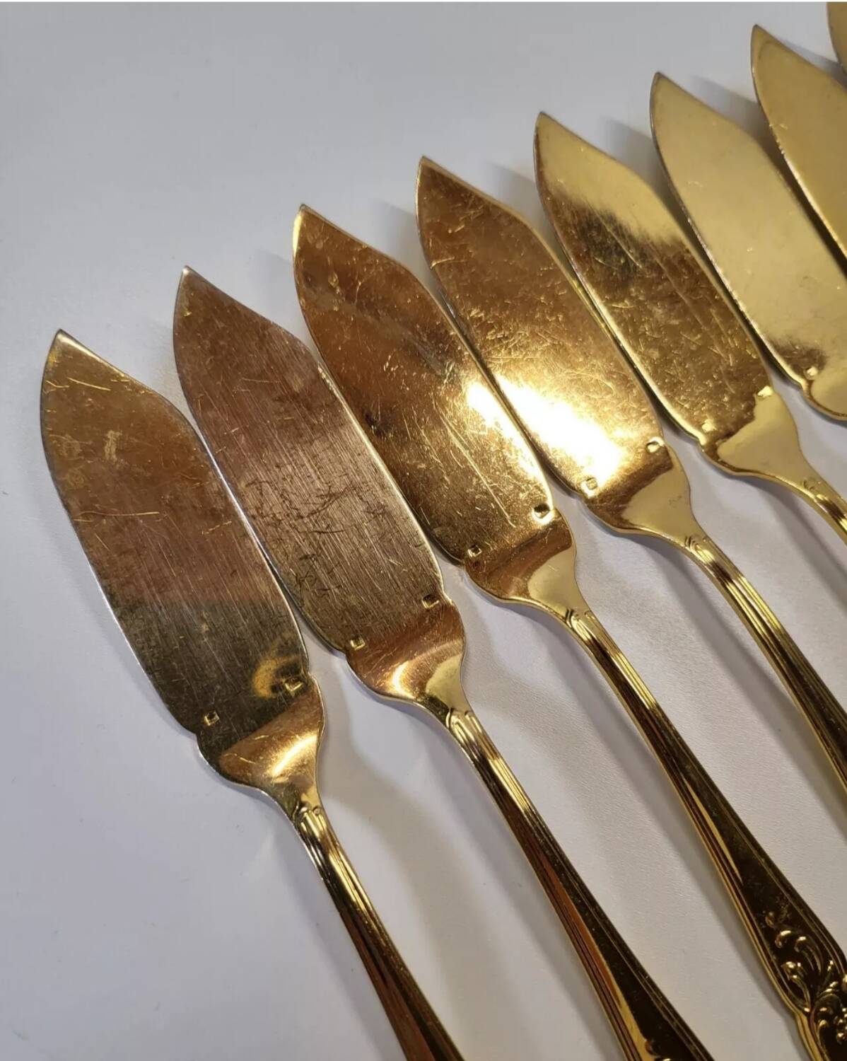 Gold metal fish cutlery, knives and forks 24 pieces