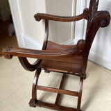 Gothic Curule Dagobert armchair in carved walnut, 19th century