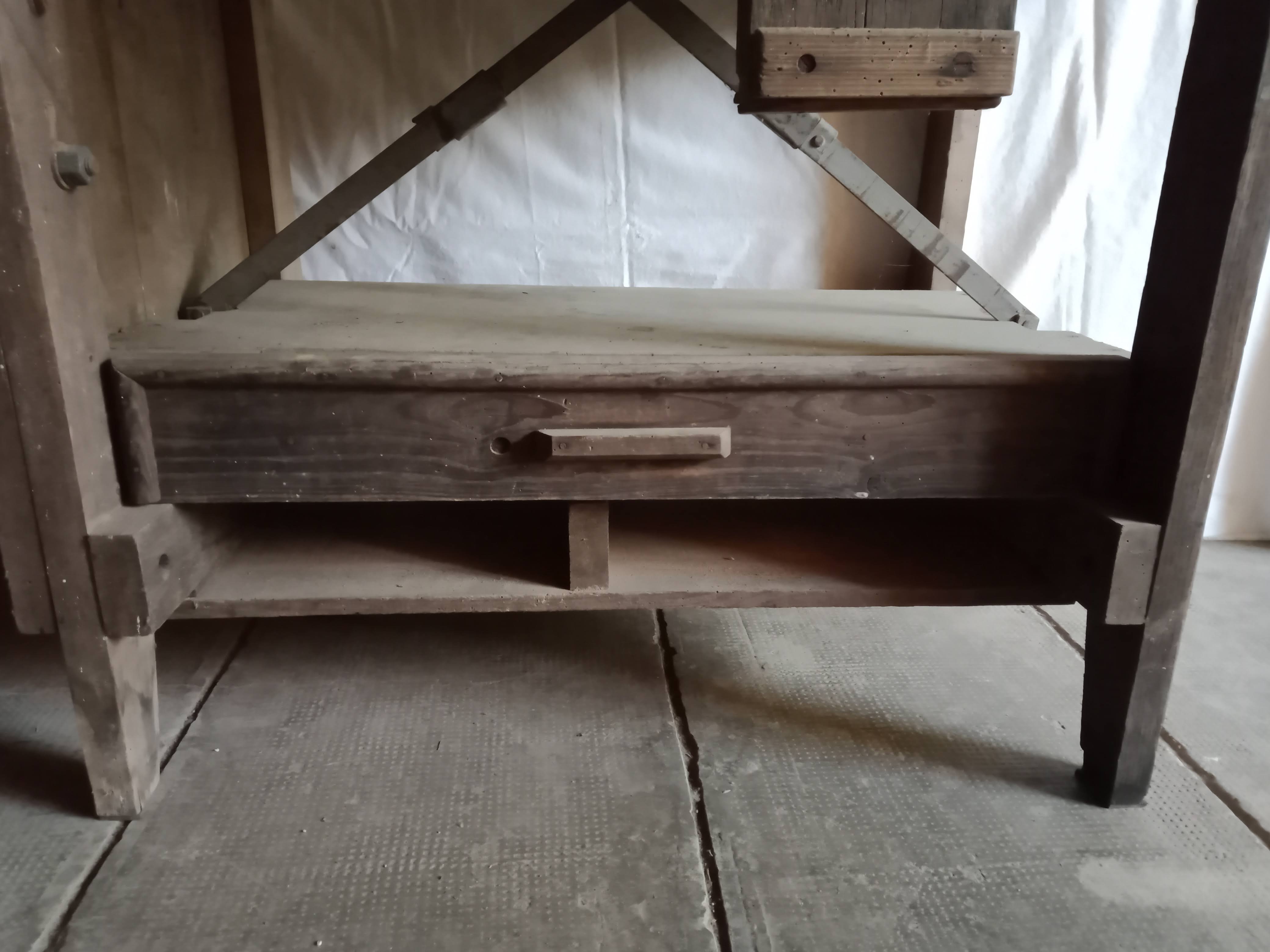antique workbench with one drawer and two vices