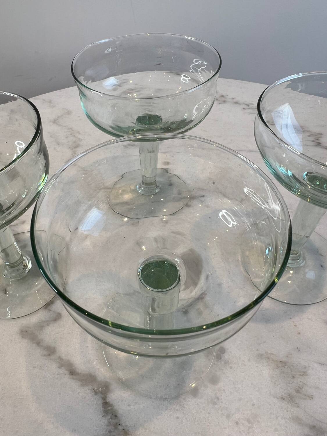 Set of four blown glass stemmed glasses.
