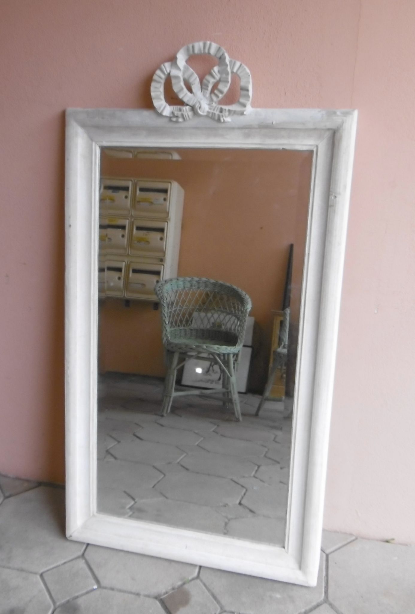 Miroir ancien style Louis XVI avec decor noeud