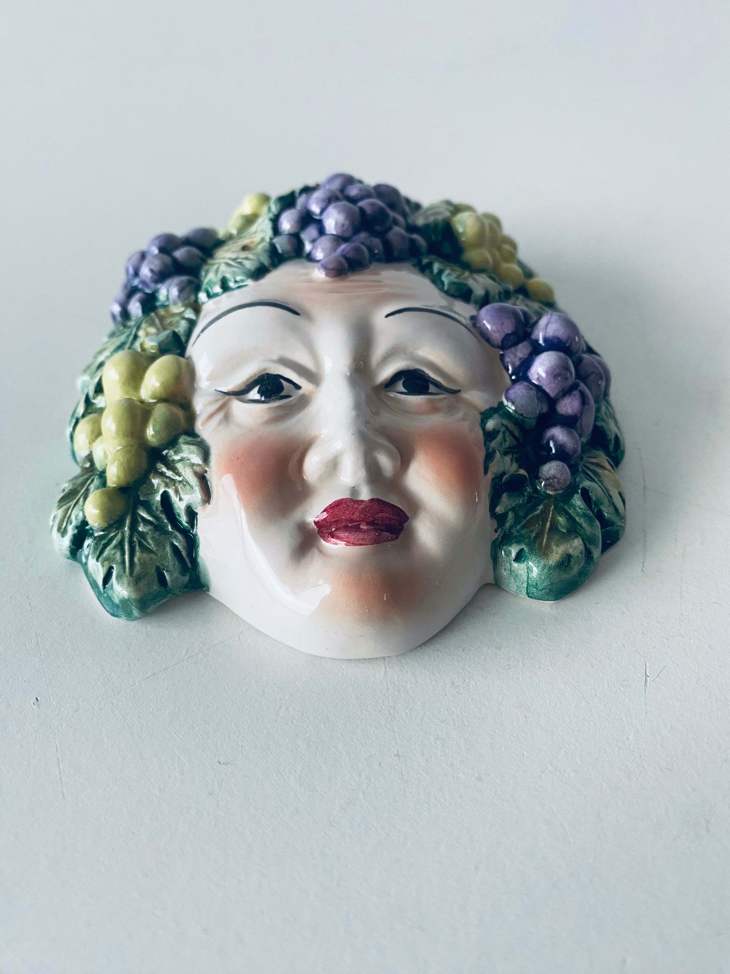 Ceramic wall face signed Il Falco