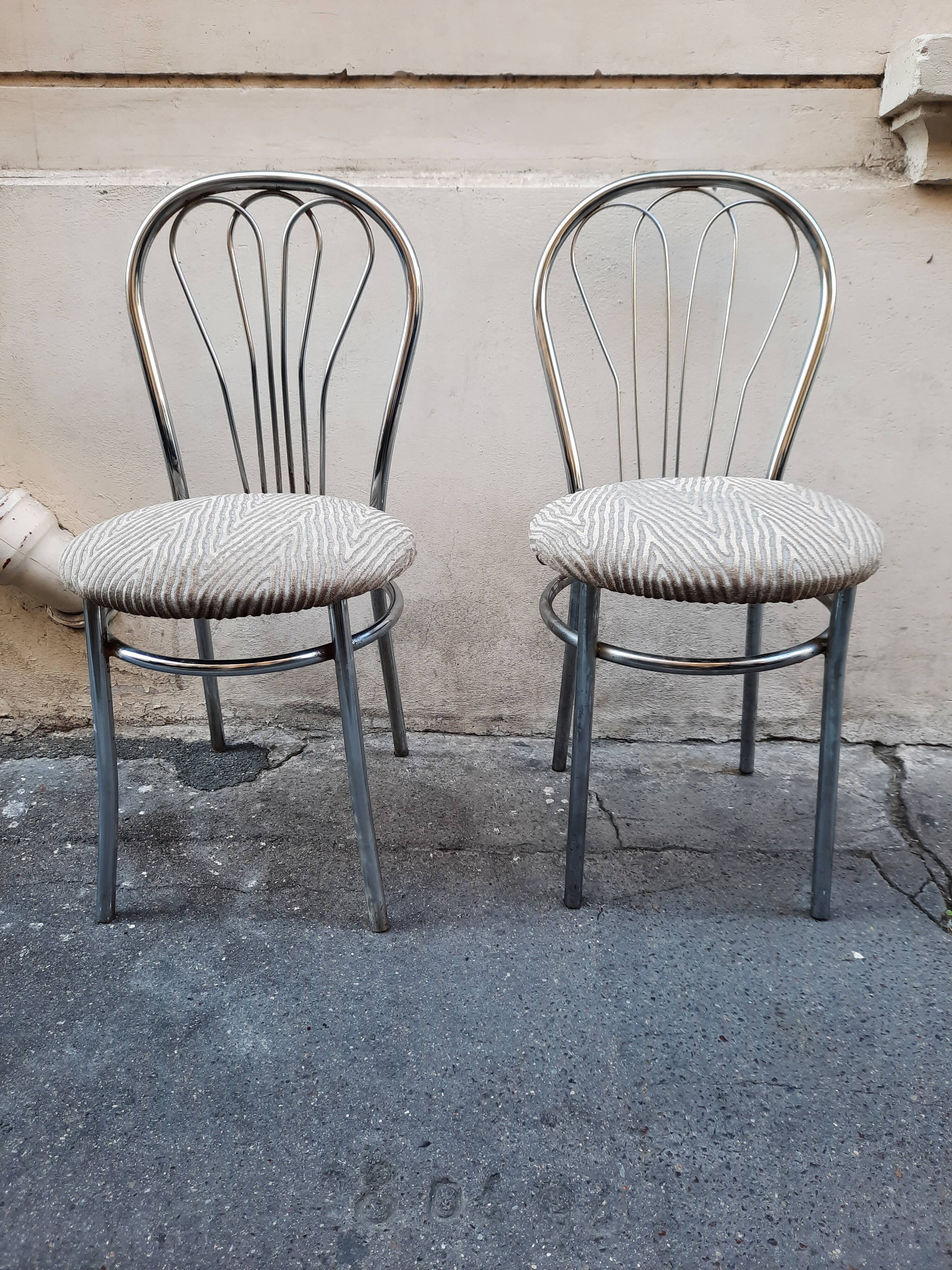 Pair of tubular metal bistro chairs