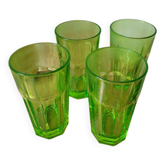 Four neon green lemonade glasses