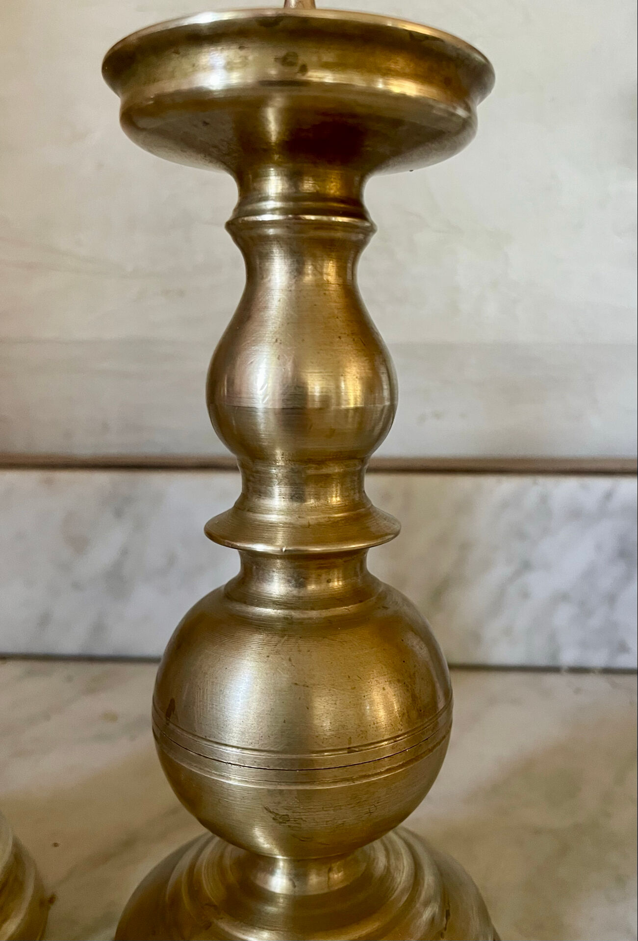 Pair of solid brass candlesticks from the 19th century.