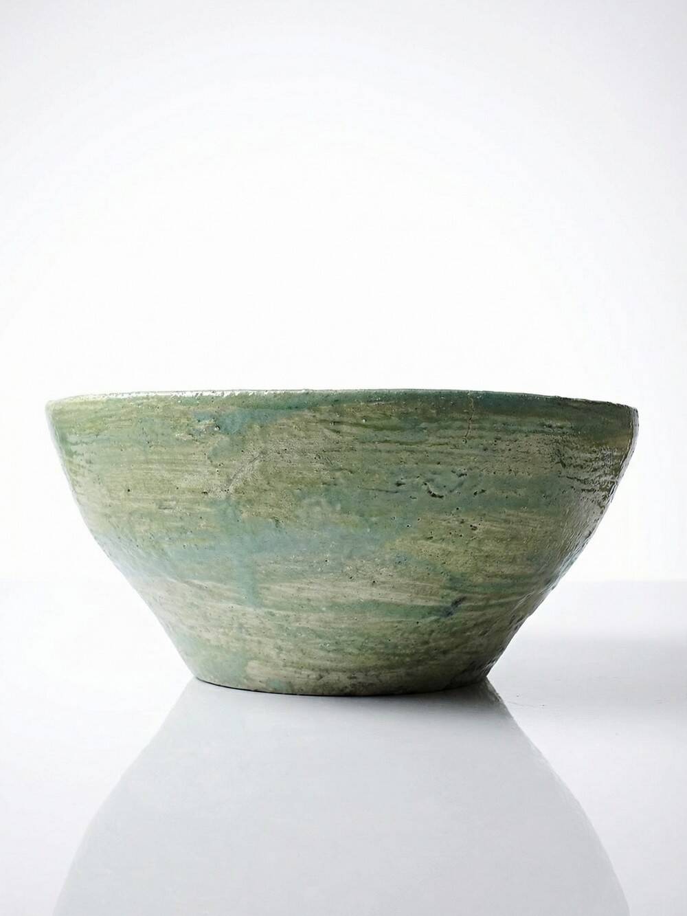 Wabi-Sabi handcrafted ceramic bowl in celadon green, 20th-19th century.