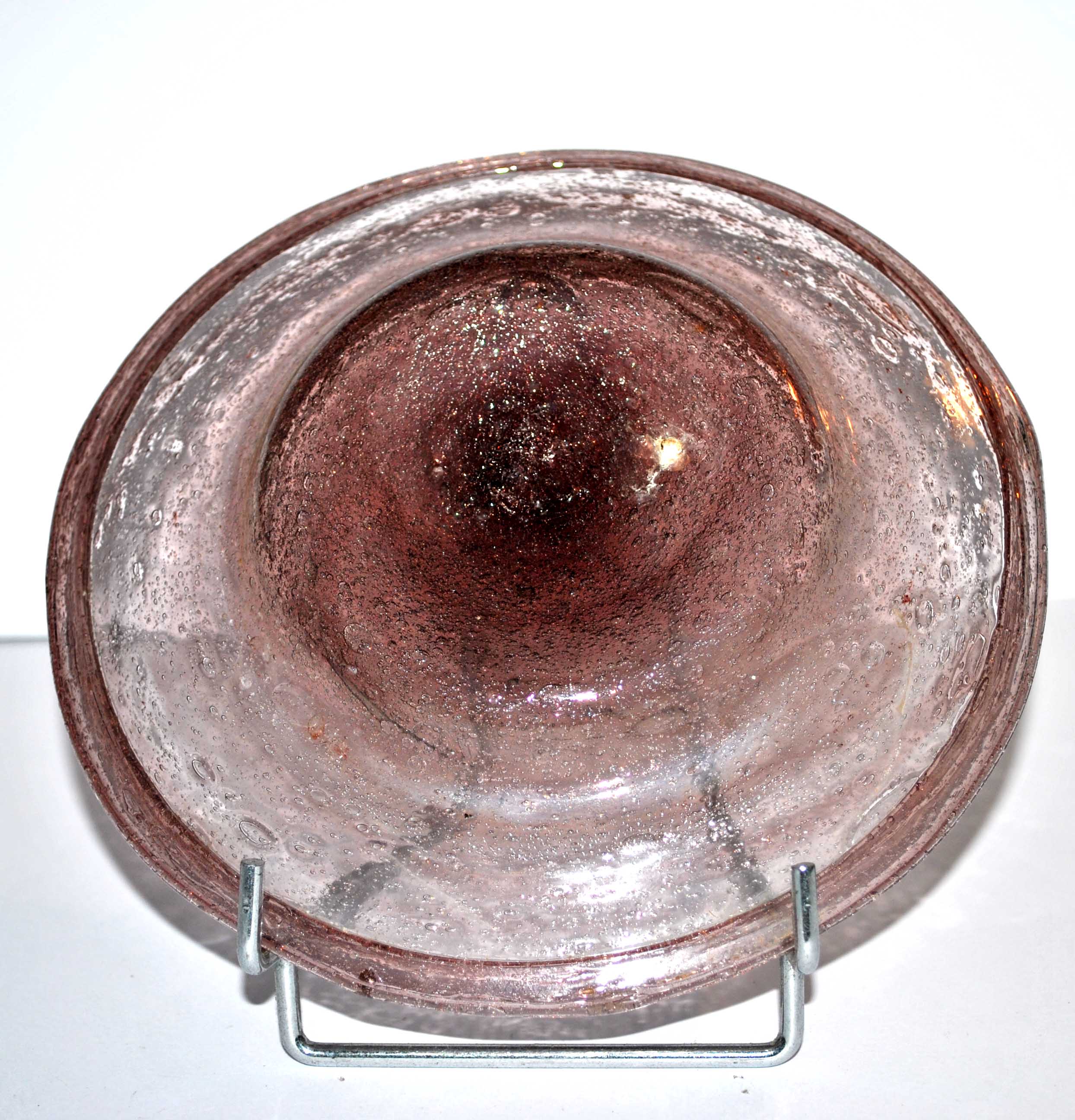 Antique plate in pink bubbled blown glass