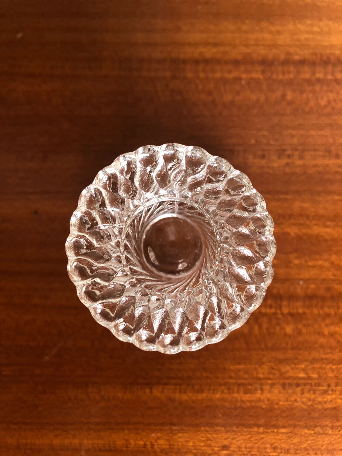 Old pair of vintage round molded glass candle holder