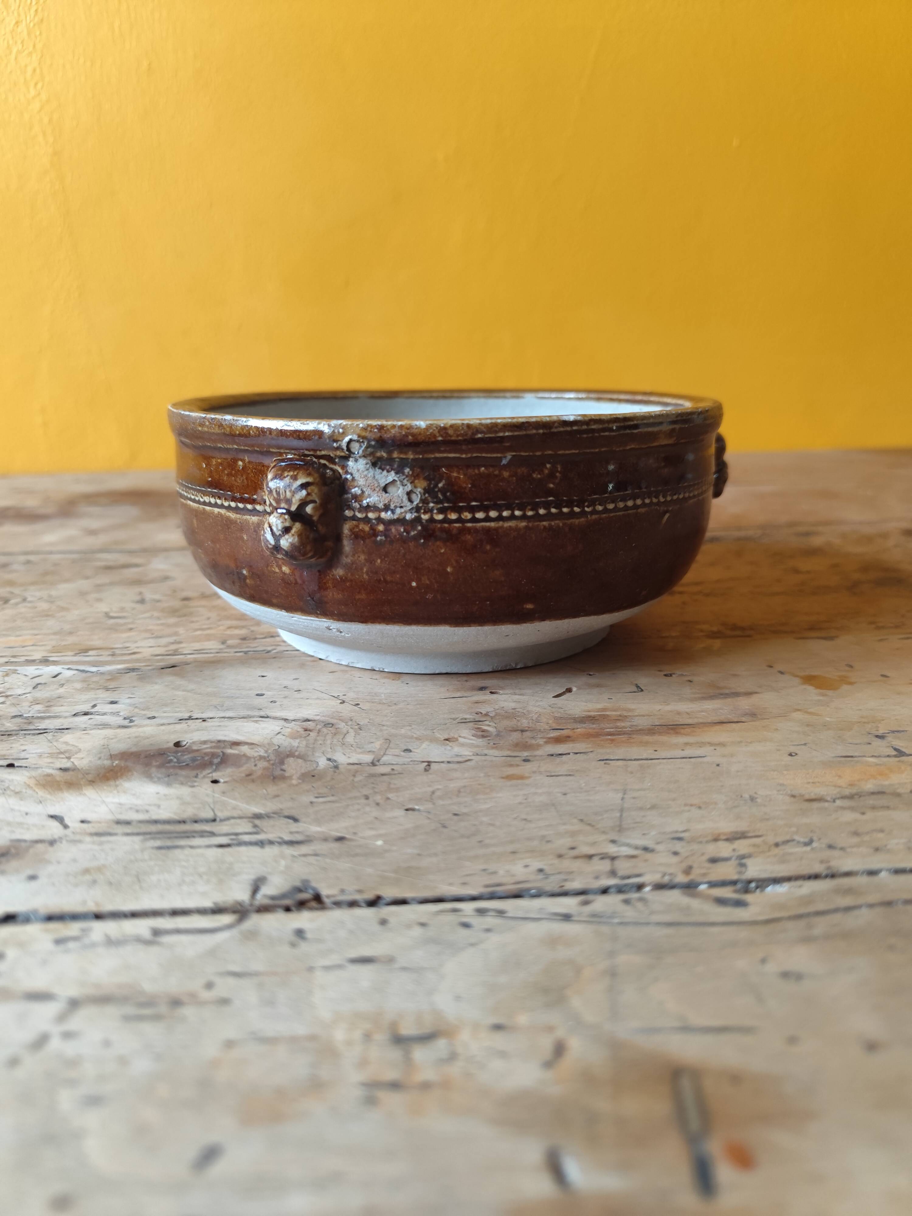 Old small glazed ceramic dish with lion head decoration - brown enamel kitchen bowl