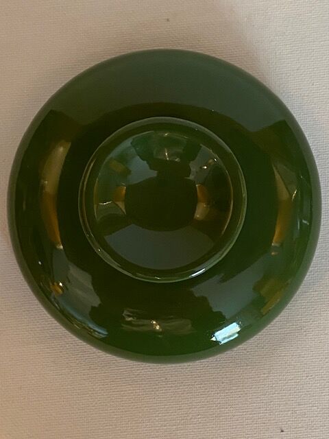 Vintage green ashtray on foot