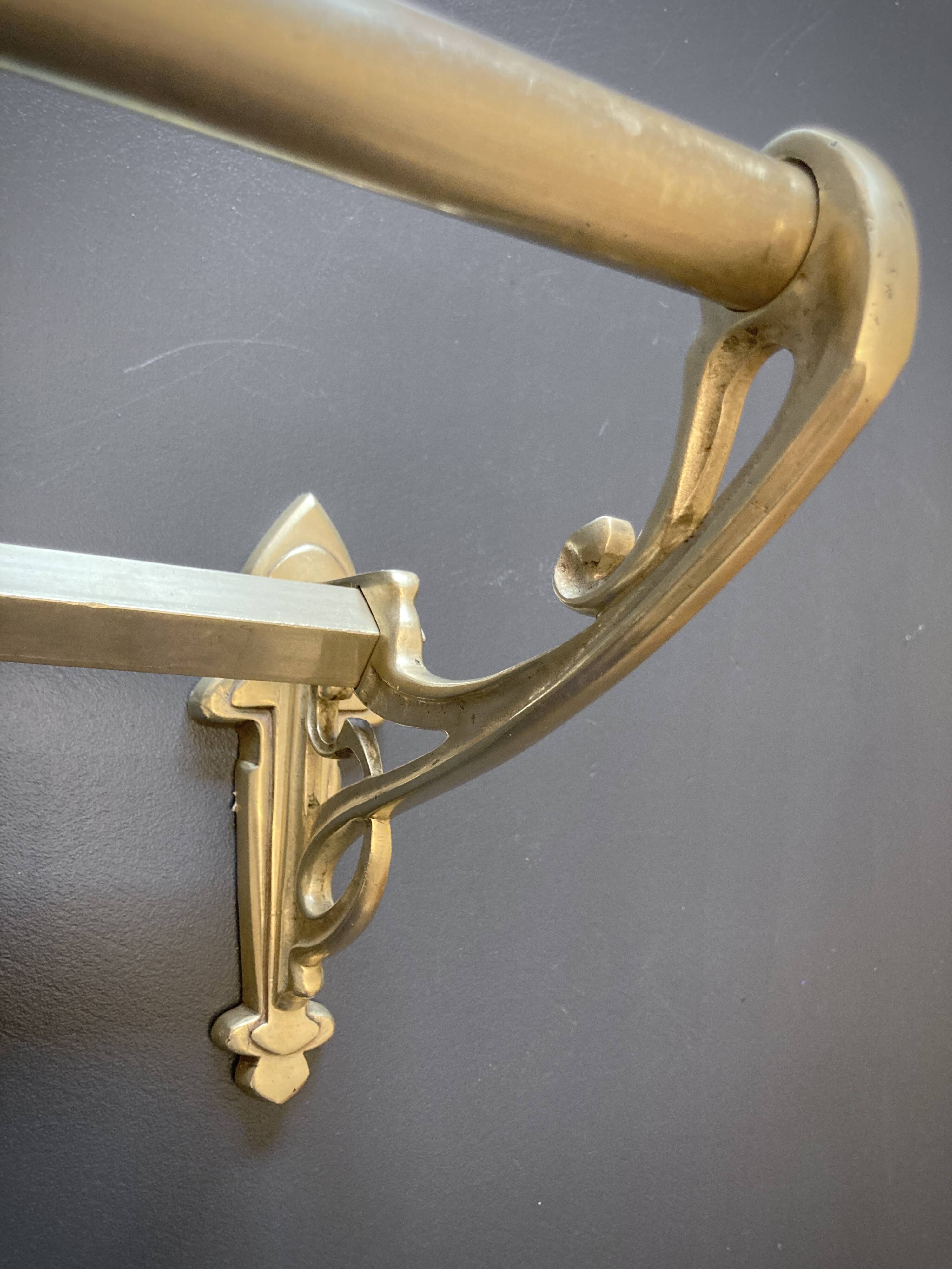 Art-deco wall-mounted coat rack in brass